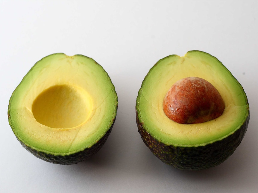 An avocado sliced in half.