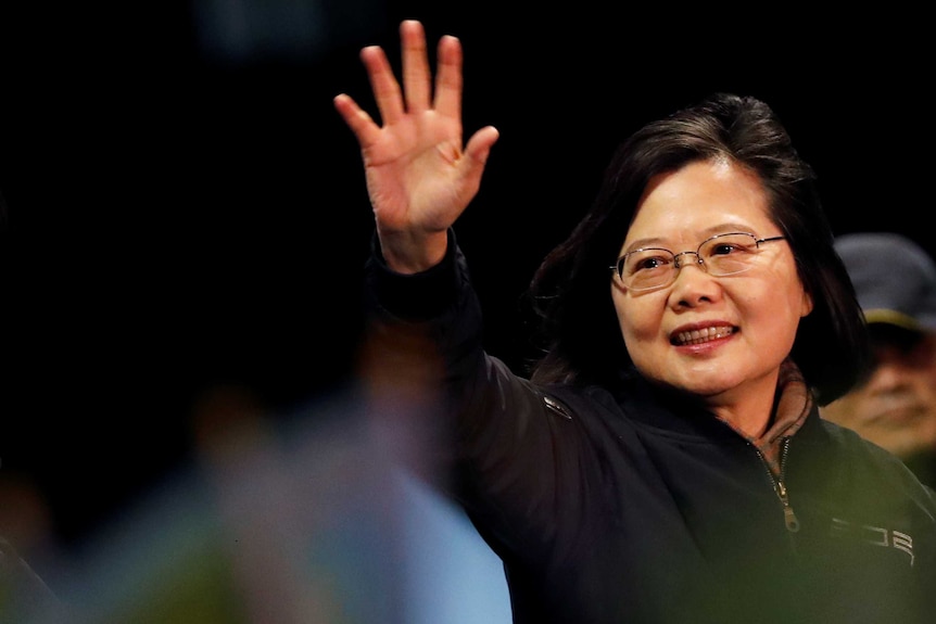 Tsai Ing-wen waves at a campaign rally