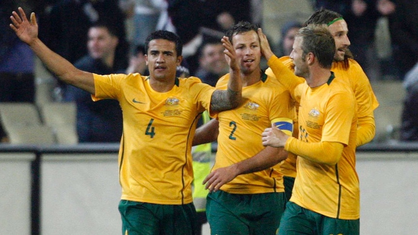 Australia's Tim Cahill (L) celebrates his second goal against Japan at the MCG in June 2009.