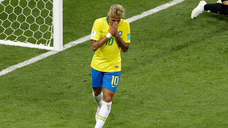 Brazil star Neymar holds his hands to his face