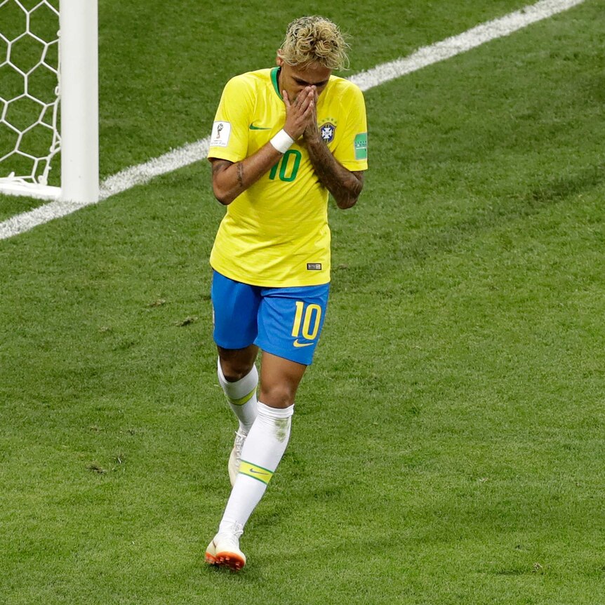 Brazil star Neymar holds his hands to his face