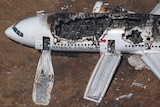Aerial view of burnt-out Boeing 777 at San Francisco airport