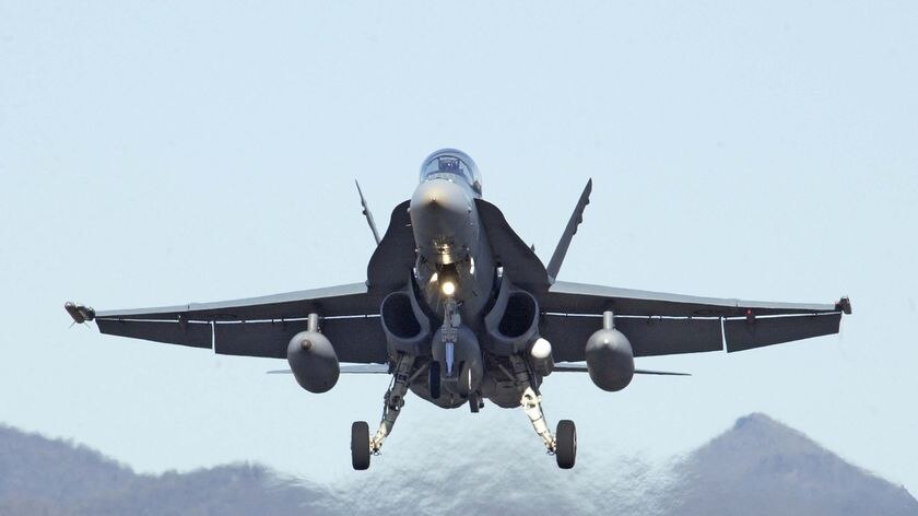 Hornet jet  makes an emergency landing at Williamtown RAAF base
