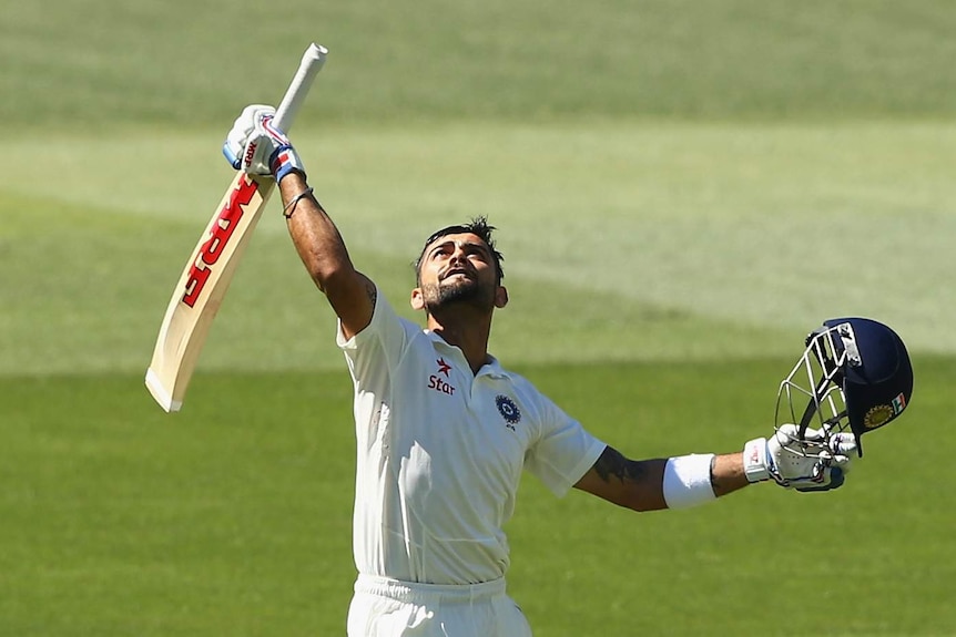 Virat Kohli celebrates his second ton of the first Test in Adelaide