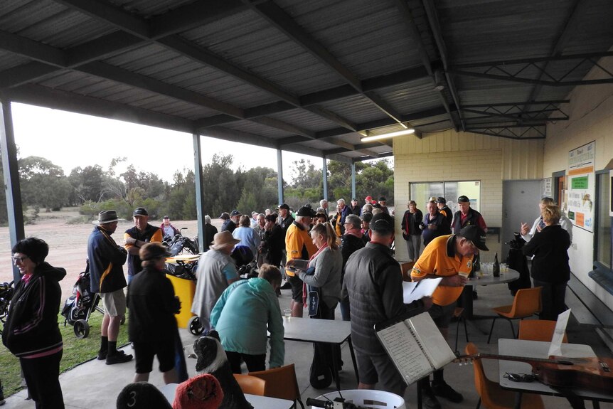Golfers mingling before tee off on the first hole at Ceduna.