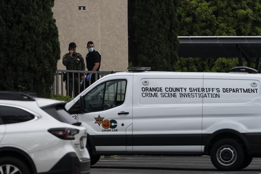 A white van with Orange County Sheriff's Department Crime Scene Investigation