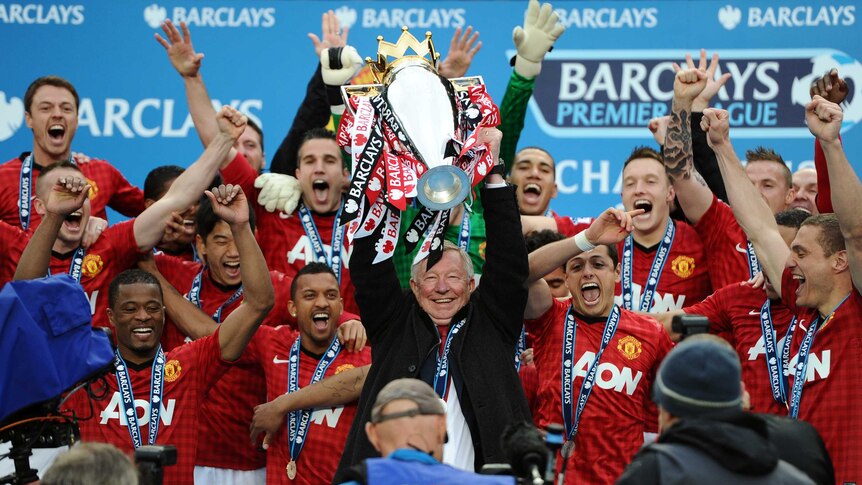 Alex Ferguson lifts the Premier League trophy after his final match in charge of Manchester united