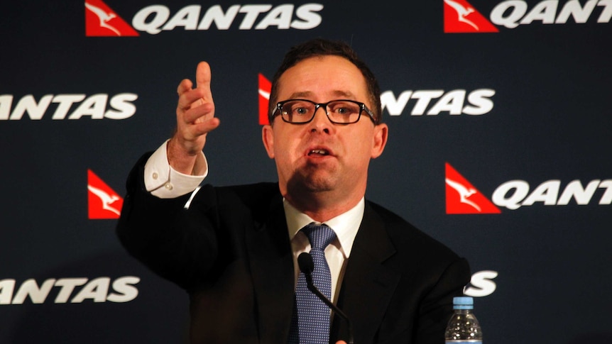 Qantas chief executive Alan Joyce announces the company's half-year results