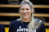 Lauren Jackson smiles while posing for a photo at the State Basketball Centre