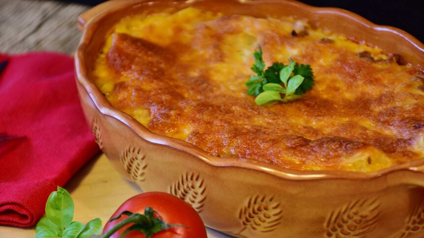 A baked lasagne fresh out of the oven.