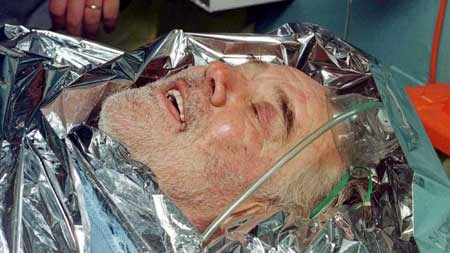 British solo sailor Tony Bullimore lies on the deck of HMAS Adelaide after being rescued in 1997