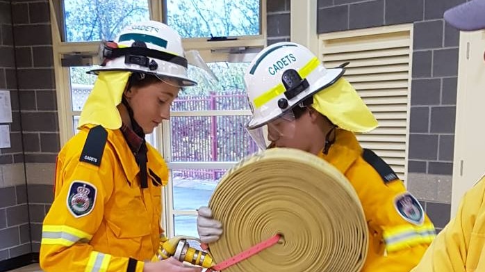 The Scots School students learning how to roll out a hose reel during their practical training.