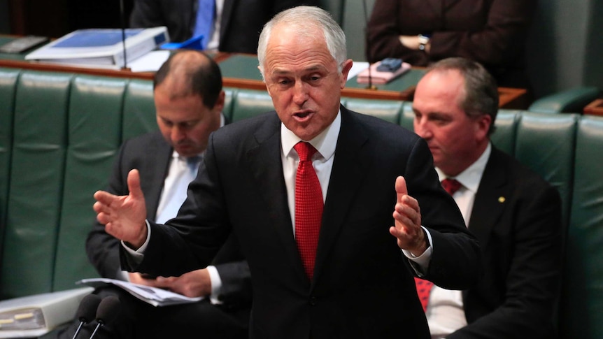 Prime Minister Malcolm Turnbull gestures with both hands as he speaks during question time in Parliament on May 22, 2017.
