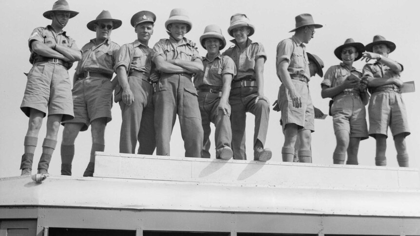 Australian and allied troops on top of bus at a race carnival in Beersheba in May, 1940