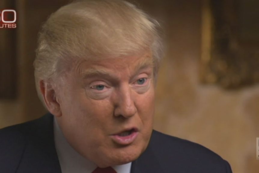 Donald Trump tells CBS's 60 Minutes programme he will accept a fence on parts of border