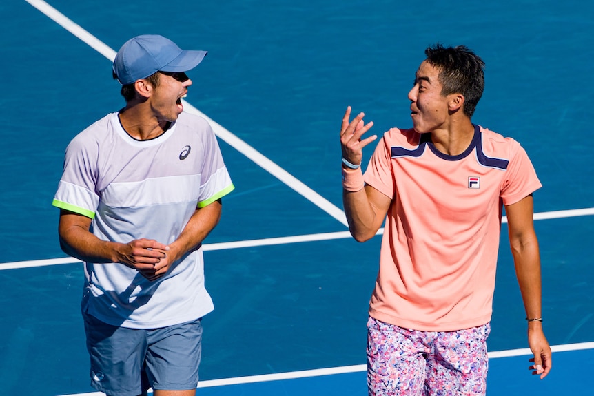 Doubles partners Rinky Hijikata and Jason Kubler share a laugh on-court at the Australian Open.