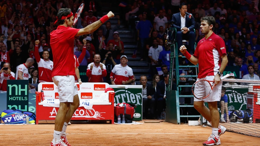 Switzerland's Roger Federer and Stan Wawrinka win doubles against France in the Davis Cup final.