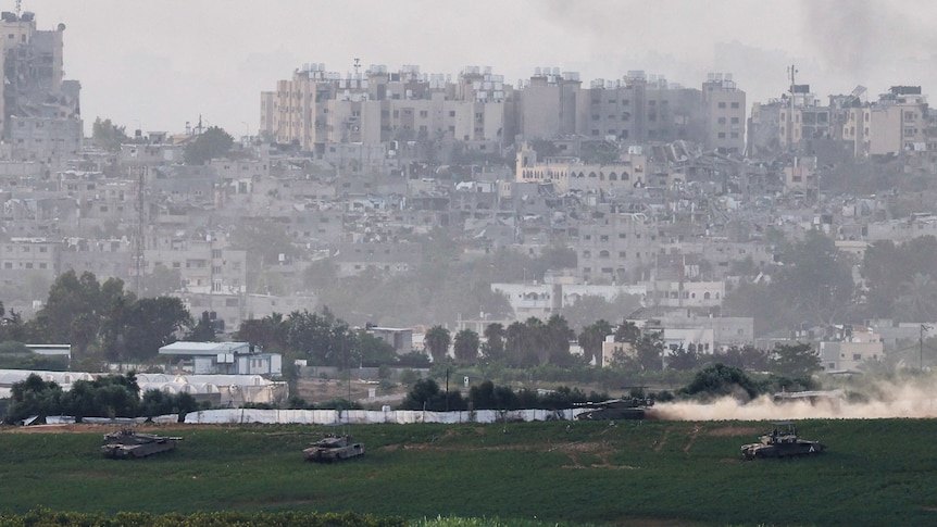 Israeli tanks manoeuvre inside the Gaza Strip, as seen from Israel,
