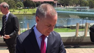 Premier Jay Weatherill looks at his watch
