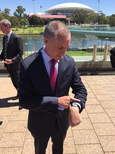 Premier Jay Weatherill looks at his watch