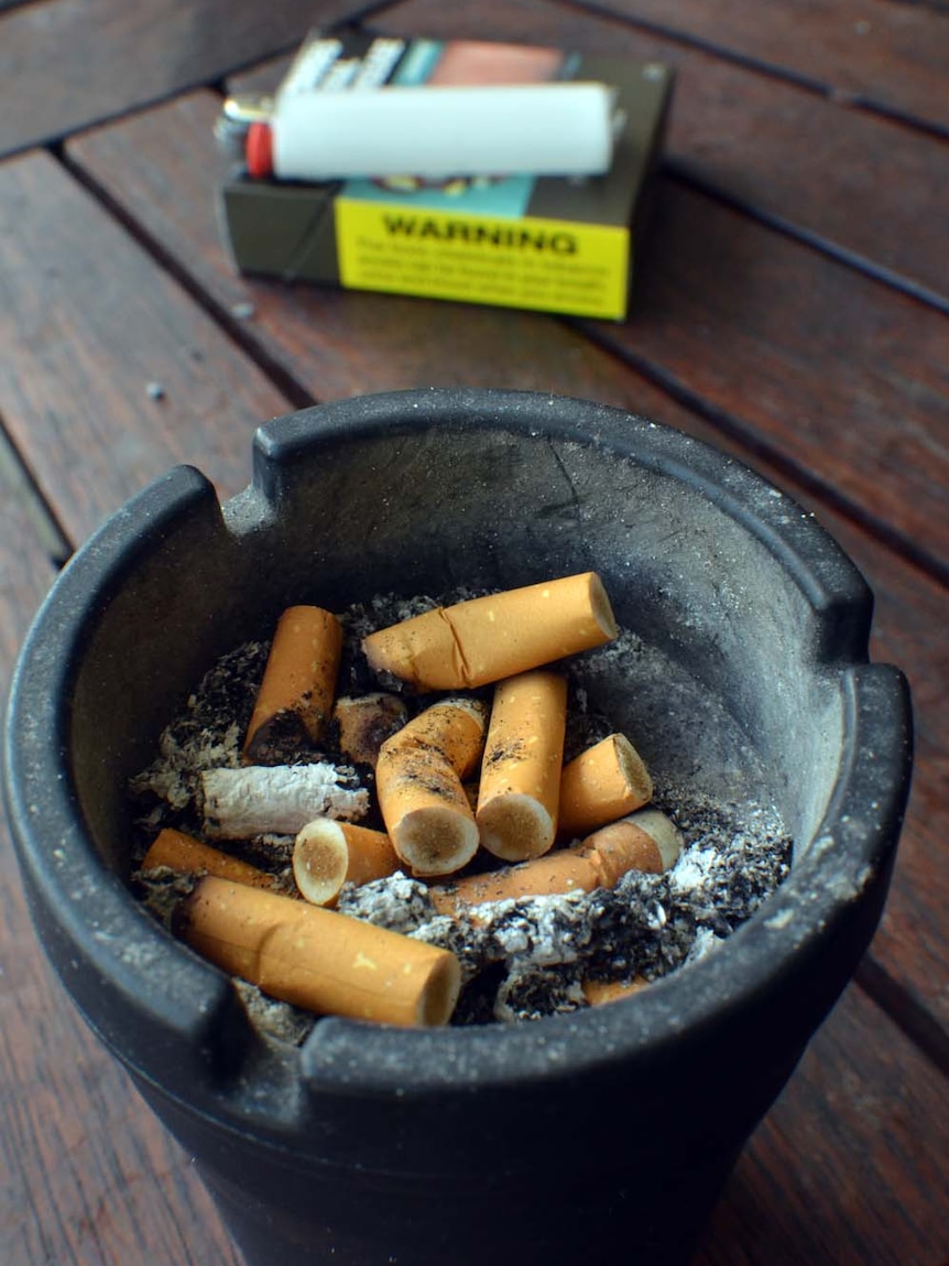 Ashtray, cigarette packet and lighter