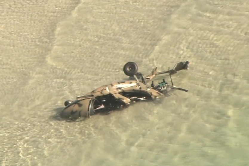 A small aircraft wreckage in the water.