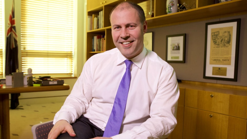 Josh Frydenberg sits cross-legged in his office at Parliament House