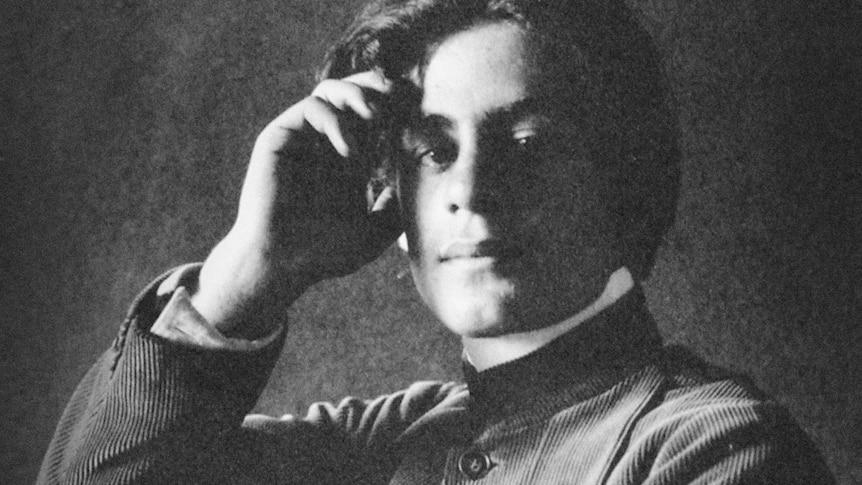Khalil Gibran as a young man looking contemplative.