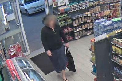 The suspect in the robbery was disguised as a woman.