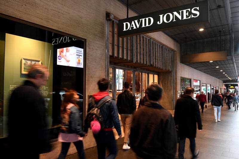 People walk past a David Jone store.