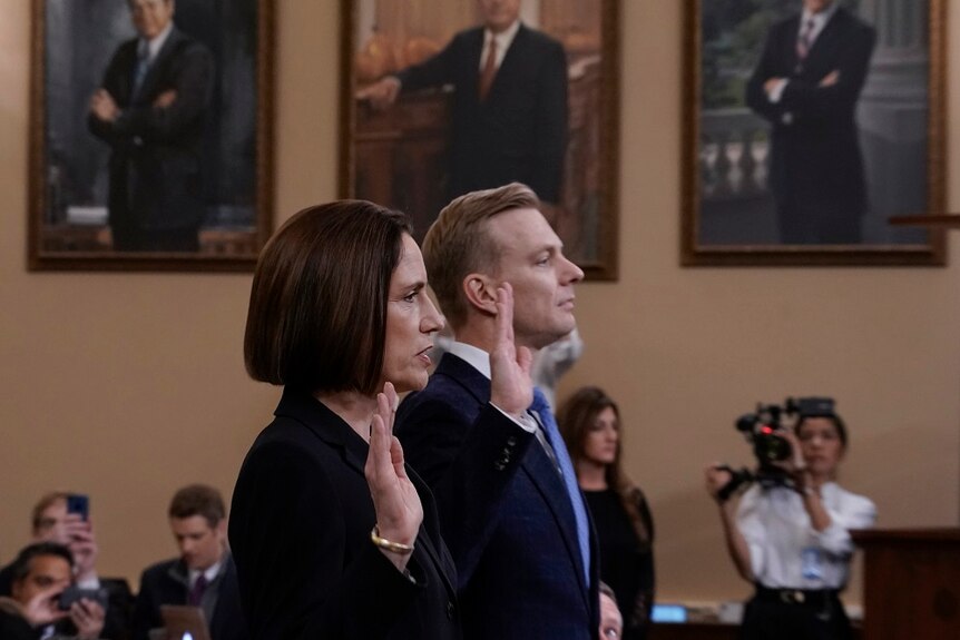 Former White House national security aide Fiona Hill, left, and David Holmes in a hearing room.