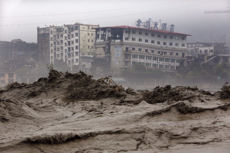 Flood waters sweep through Beichuan in Sichuan province as heavy rain causes landslides