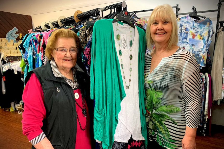 Two women in a dress shop.