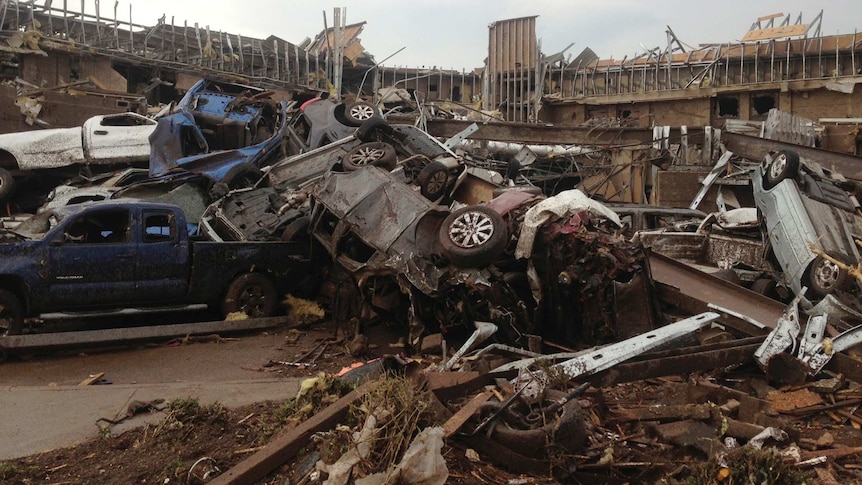 Tornado-damaged cars, buildings in Moore