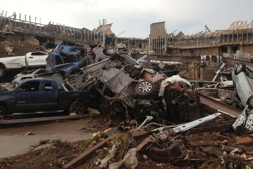 Tornado-damaged cars, buildings in Moore