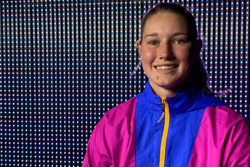 Tayla Harris wears a pink and blue jacket.