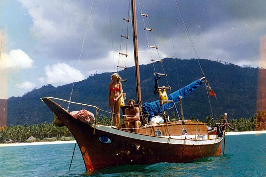 A man and a woman on a yacht.