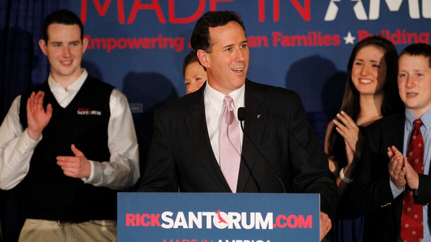 Rick Santorum is applauded by his family at his Alabama and Mississippi primary election night rally