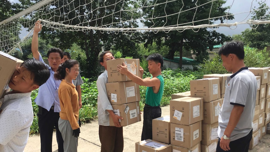 Christian Friends of Korea carry boxes full of charity goods for North Korea