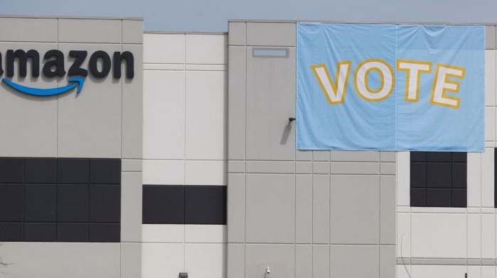 Amazon warehouse with a Vote sign