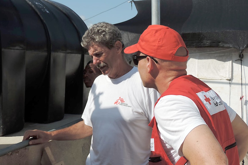 Darwin humanitarian Dan Baschiera trains a nurse from the Norwegian Red Cross