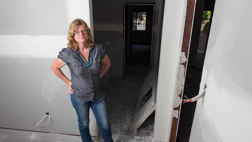 Dungog resident Kathryn Wittmann stands in her house.