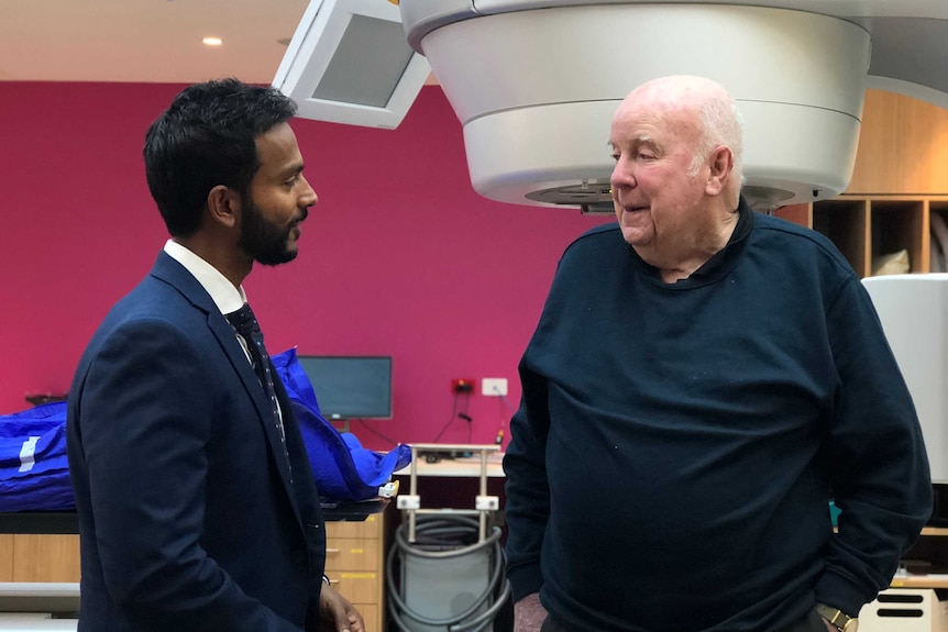 Associate Professor Shankar Siva talking to prostate cancer patient Tony McDonnell