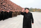 North Korean leader Kim Jong-Un attends a gathering with military officers.