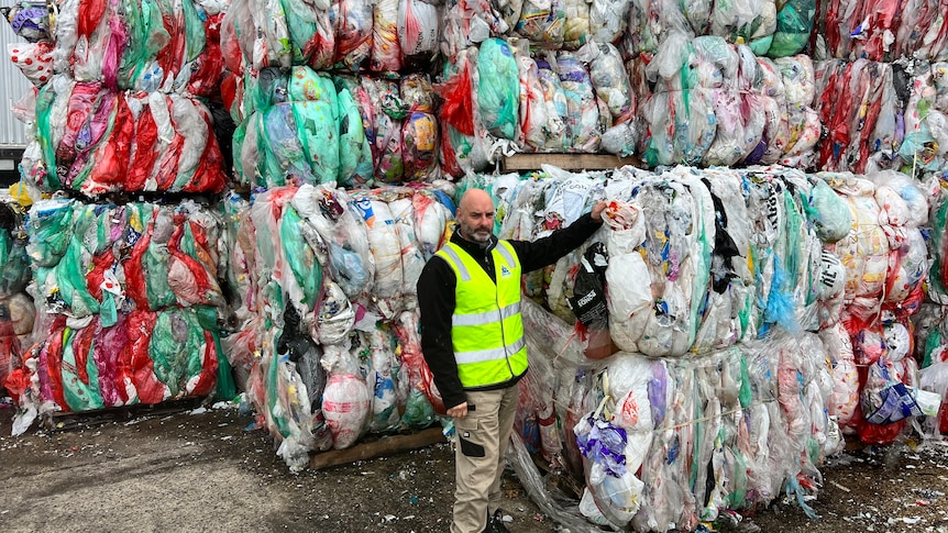 replas general manager paul hone stands with bales of redcycle collected soft plastics