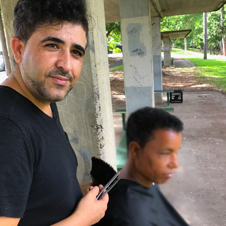 Brisbane barber Amin Eslami offers free haircuts to Brisbane's homeless on his day off