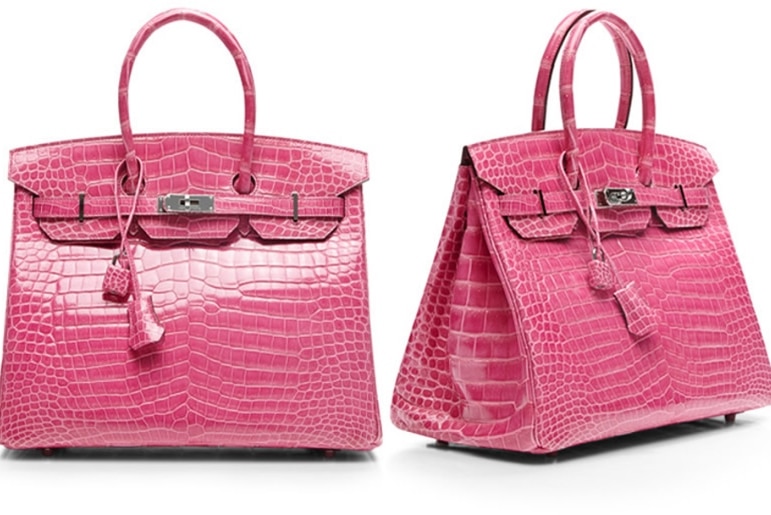 Two pink crocodile skin handbags