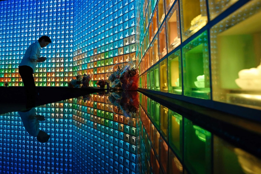 A woman prays at one of Japan's "skyscraper graveyards"