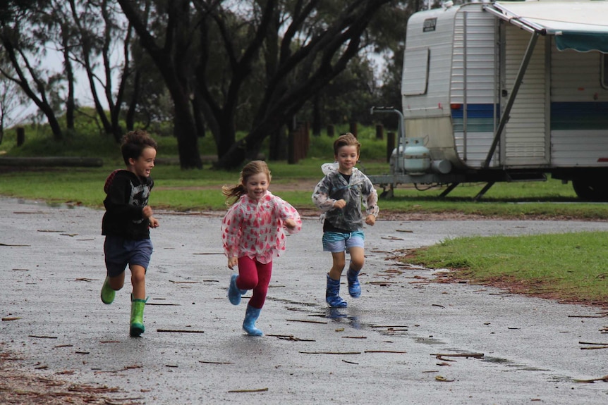 Children running in a caravan park.