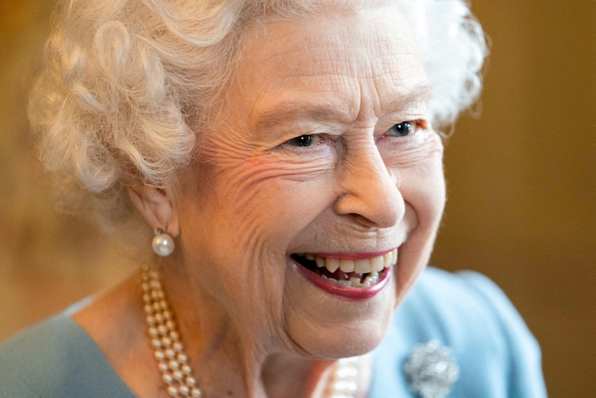 Queen Elizabeth smiles at a reception for her Platinum Jubilee, February 5, 2022.